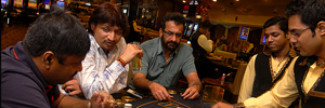 Indian players gambling at table